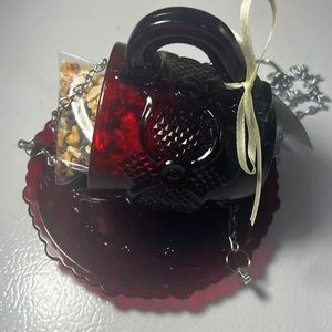 Cup and saucer bird feeder made of vintage glassware.